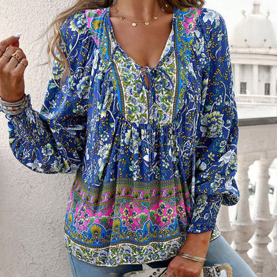 Boho chic long sleeve blouse in blue floral print with lace-up detail, perfect for vacation style and casual wear.