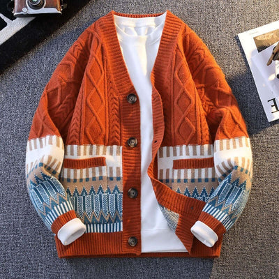 Warm orange knitwear cardigan with geometric patterns and buttons, suitable for casual outings.