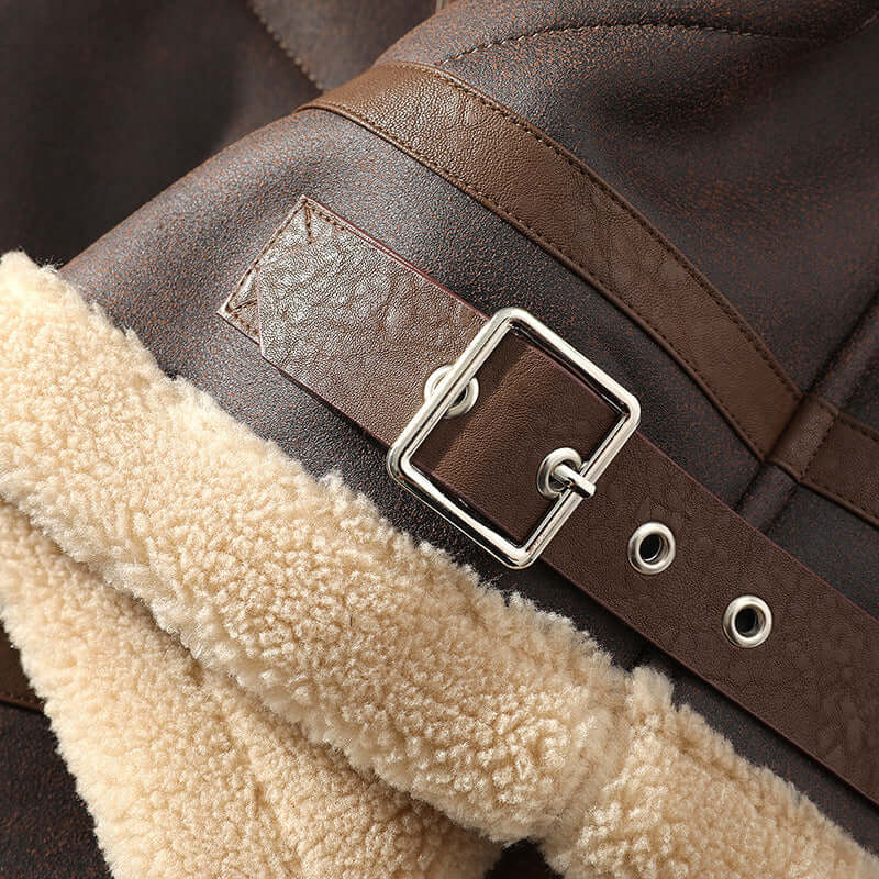 Close-up of a brown men's casual jacket featuring a fur-lined collar and a metal buckle detail.