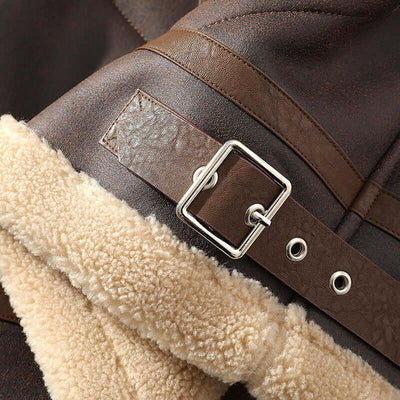 Close-up of a brown men's casual jacket featuring a fur-lined collar and a metal buckle detail.