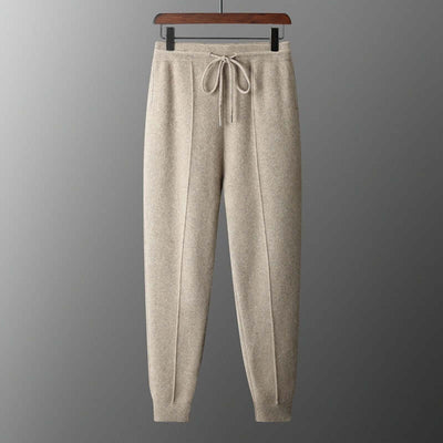 Men's warm cashmere pants in camel color with drawstring and tapered fit for casual wear.