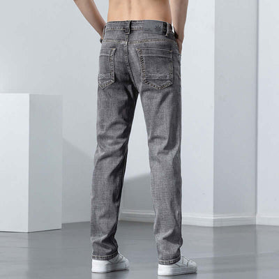 Back view of versatile retro gray jeans for men, showcasing micro-elastic fabric and mid-waist design.
