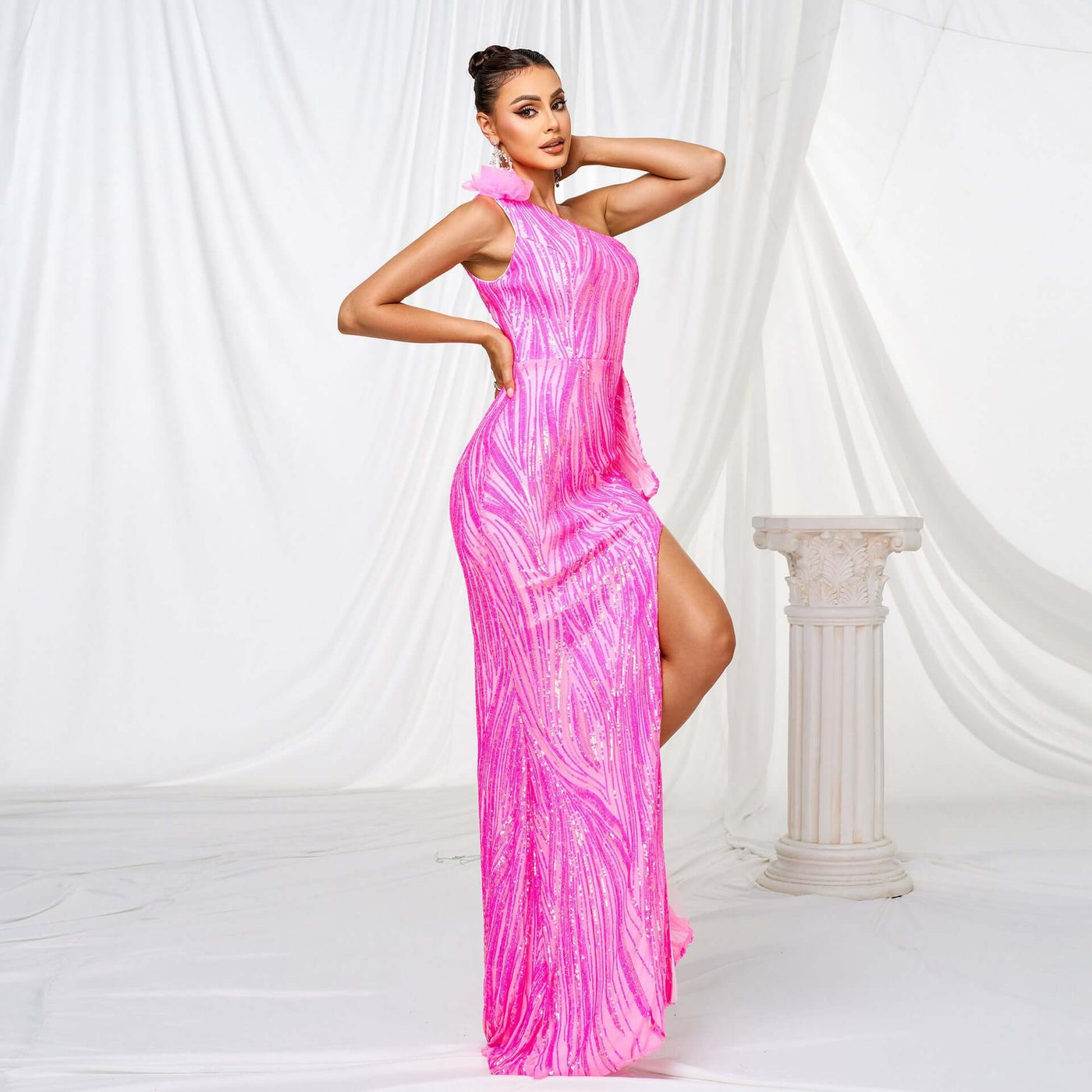 Elegant formal dress featuring sequins, single sleeve, and front slit