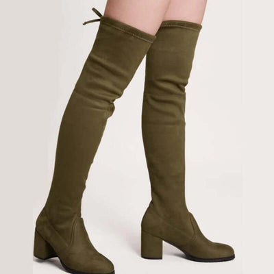 Olive green chunky heeled high boots with a thigh-high design, perfect for fashion-forward outfits.