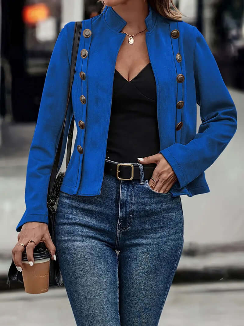 Blue long-sleeved deerskin velvet coat with double-row metal buckle, styled with jeans and a black top.