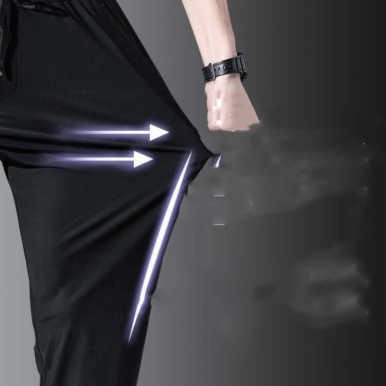 Close-up of breathable thin black straight pants for men highlighting high elasticity and quick-drying fabric.