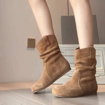 Women's khaki Western denim Martin boots with low heel and flat sole, showcasing stylish design and comfort.