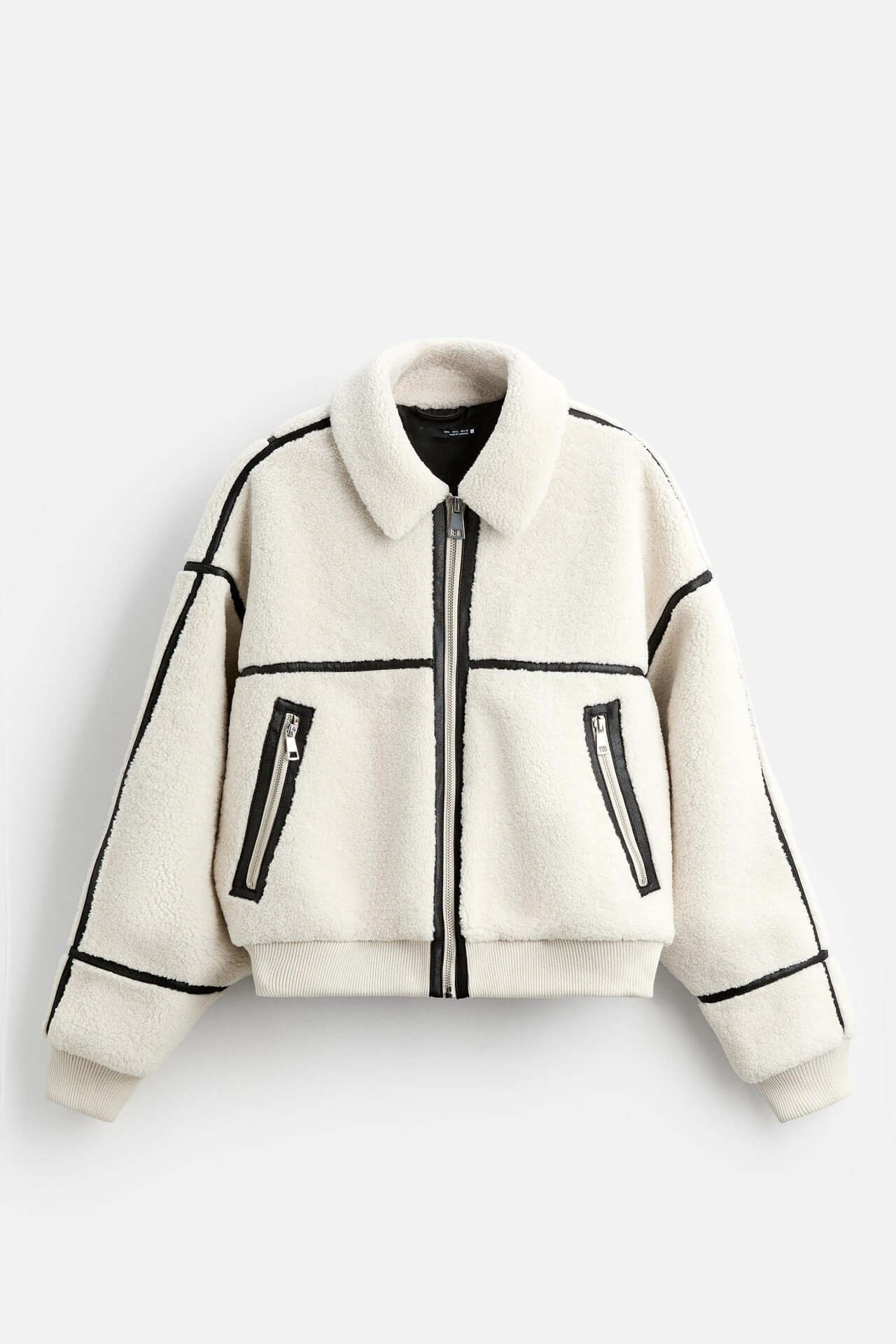Men's simple lapel fleece jacket in solid ground white with black accents, featuring zippered pockets and a casual style.