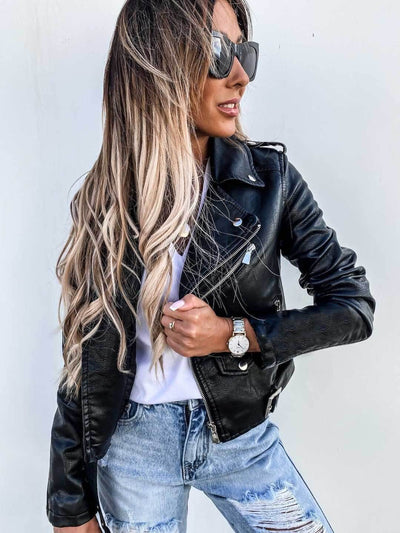 Model wearing a stylish black PU leather jacket with long sleeves and ripped jeans, showcasing a trendy, casual look.