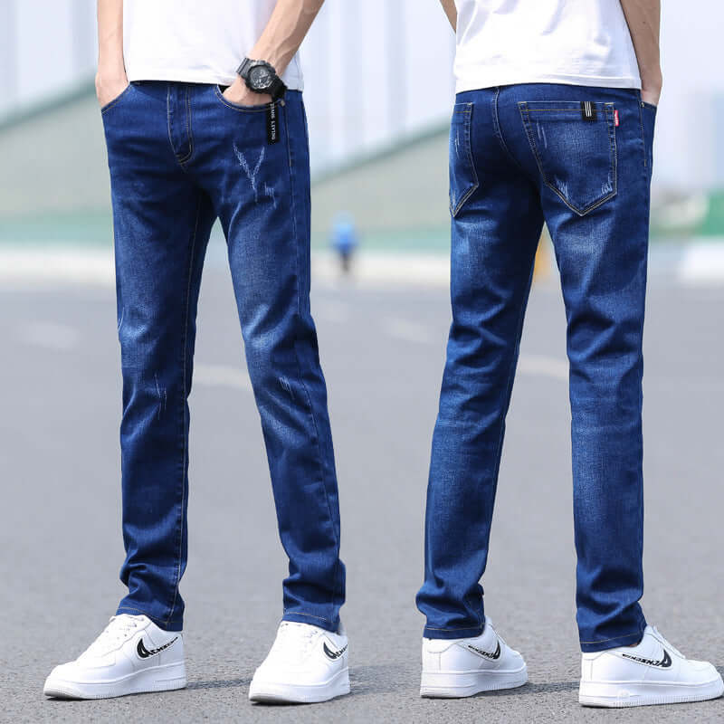 Men's slim straight denim trousers in dark blue, styled with a basic fit for spring and summer fashion.