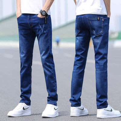 Men's slim straight denim trousers in dark blue, styled with a basic fit for spring and summer fashion.