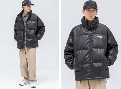 Stylish black stand-up collar jacket for men, paired with casual attire, perfect for cold weather.