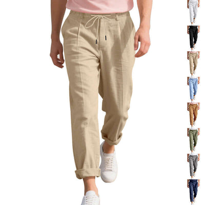 Men's casual summer linen pants in light khaki, featuring a drawstring waistband and straight leg design for a loose fit.