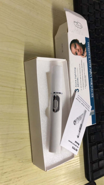 Blue light therapy acne laser pen in packaging for skincare and wrinkle removal treatment.