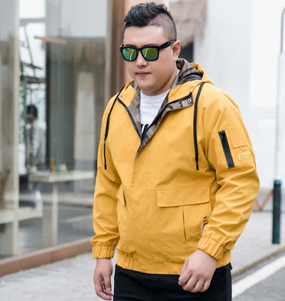 Men's bomber jacket in yellow, styled with sunglasses, perfect for casual fashion in urban settings.