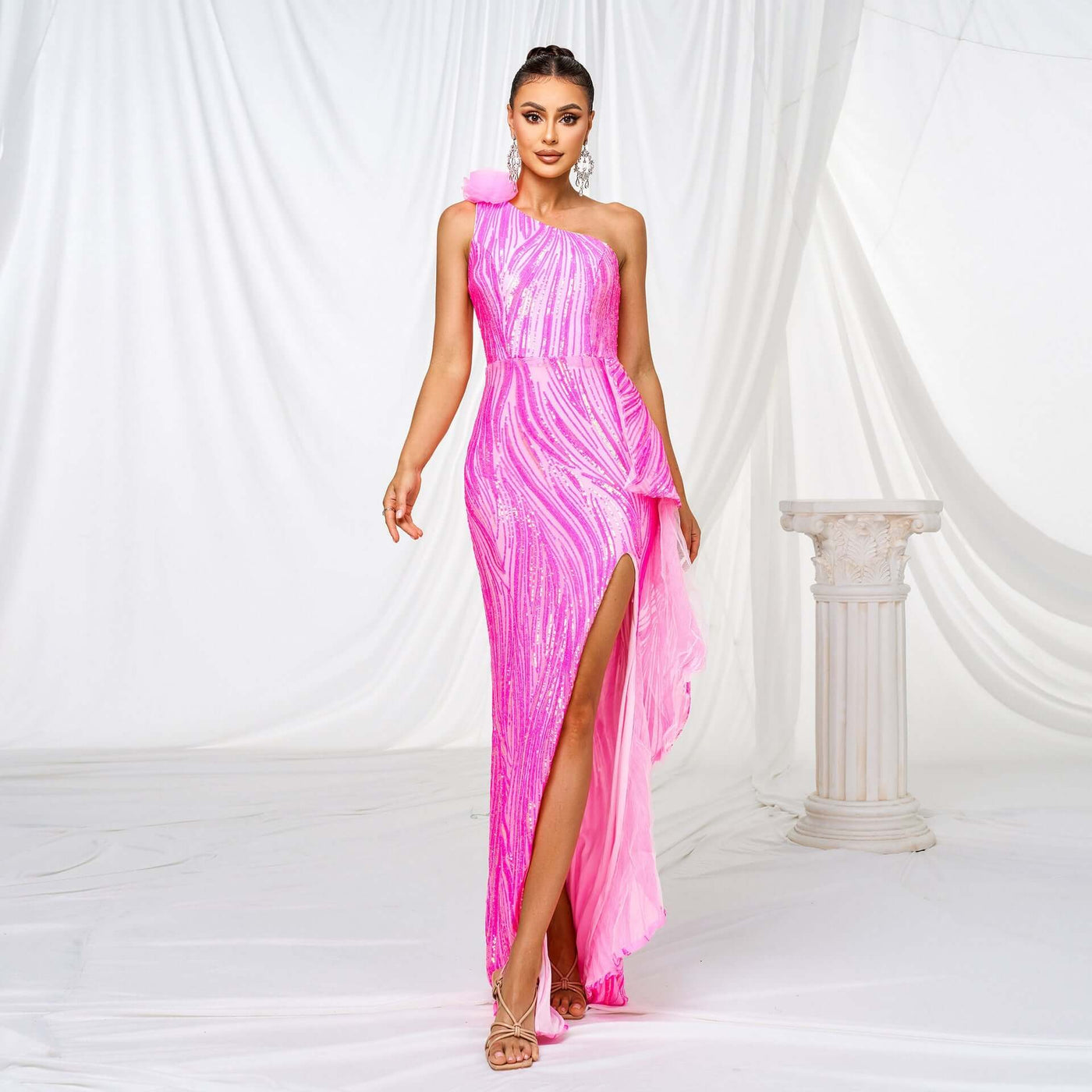 Elegant formal dress featuring sequins, single sleeve, and front slit