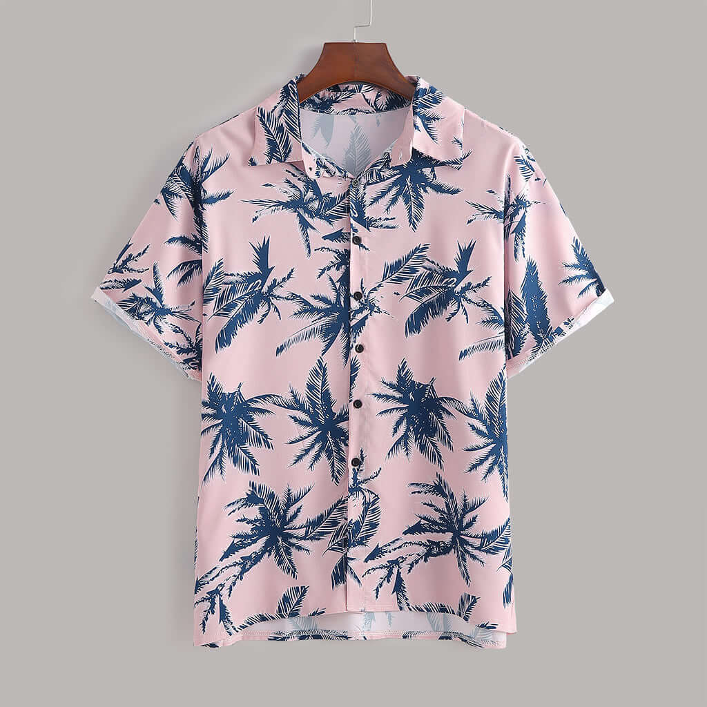 Men's pink short-sleeve shirt with navy palm tree print, perfect for casual summer outings.