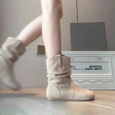 Women's khaki Western denim Martin boots with a low heel, showcased while walking.