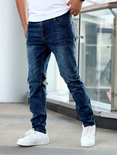 Slim fit stretch men's youth blue casual pants paired with white sneakers, showcasing a modern denim look.