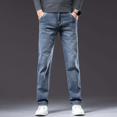 Men's loose straight stretch pants in blue denim, mid waist, perfect for teenagers, featuring a casual look.