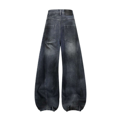 Back view of retro washed ripped deconstruction stitching straight jeans in dark blue denim fabric.