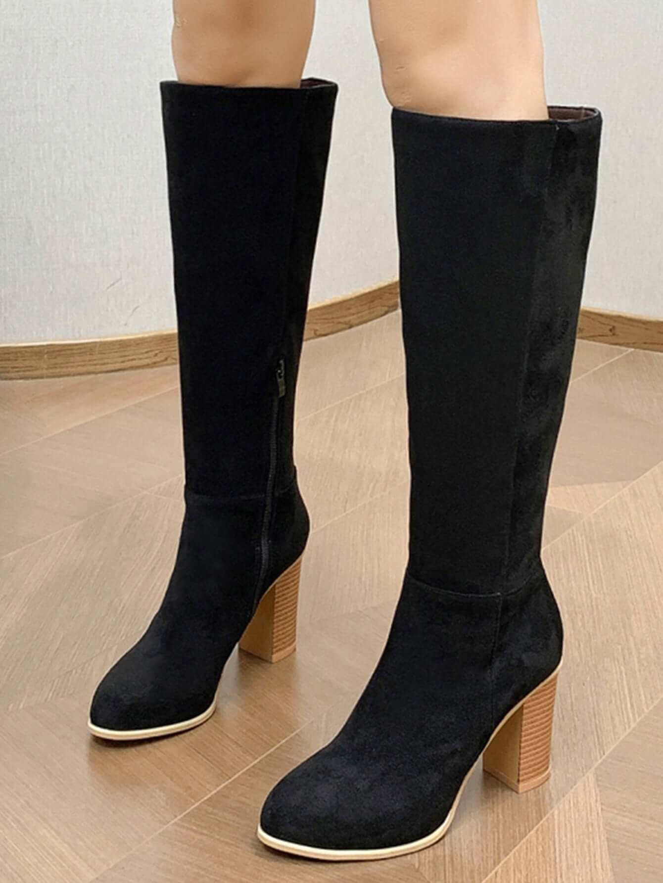 Stylish women's square toe high heel black fashion boots with a sleek design and sturdy heel.