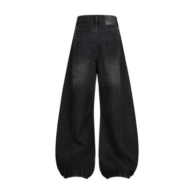 Back view of dark blue retro washed ripped straight jeans with deconstruction stitching design.
