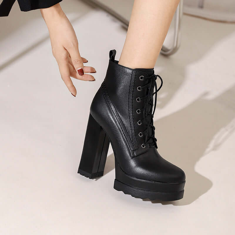 Women's black chunky heel platform boots with lace-up design and high heel, perfect for stylish and waterproof wear.