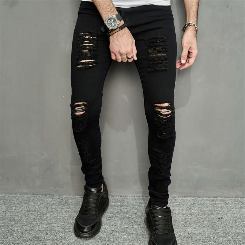 Men's trendy ripped denim jeans with a stylish pencil fit in black, ideal for casual wear.