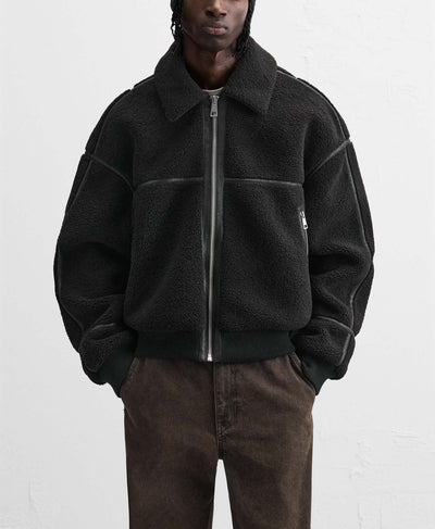 Men's casual fleece jacket in solid black with a lapel collar and zip closure, suitable for winter wear.