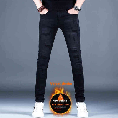 Men's black ripped jeans made from soft velvet denim for warmth and comfort, styled with a slim fit.