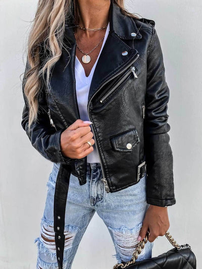 Stylish woman wearing a black PU leather short zipper jacket with distressed jeans and accessories.