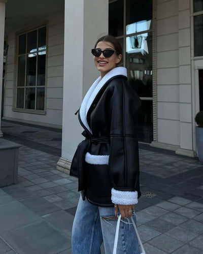 Model wearing a stylish dark brown and white Korean style long sleeve splicing coat with sunglasses.