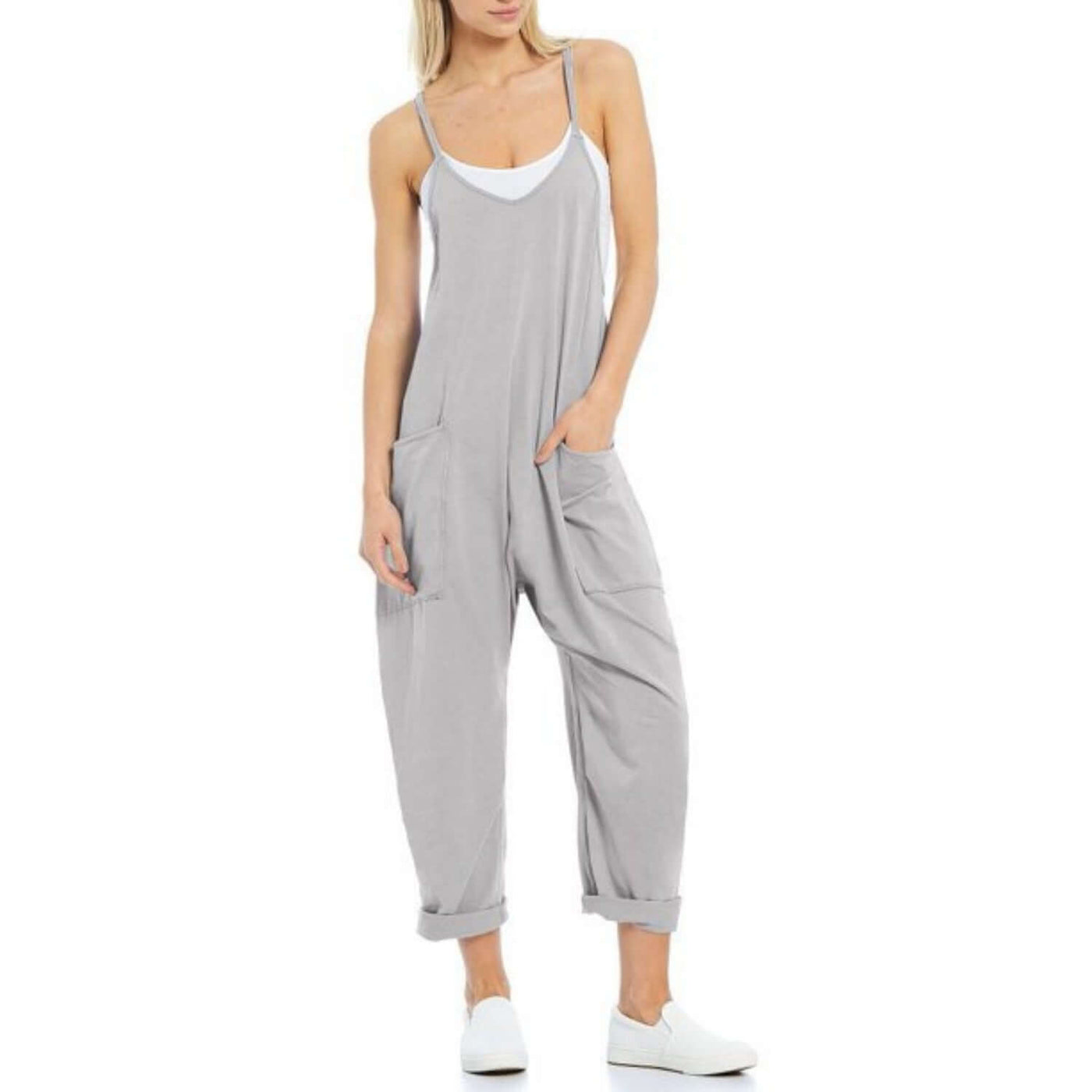 Chic sleeveless jumpsuit for women featuring adjustable straps and pockets