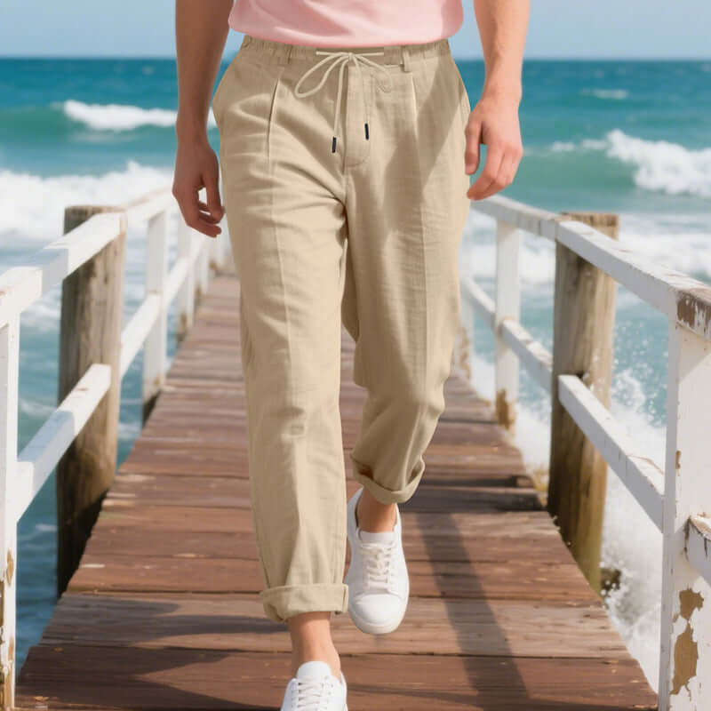 Men's casual linen pants in light khaki, perfect for summer leisure, featuring a drawstring and loose straight fit.