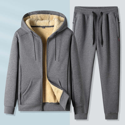 Gray men's leisure sports suit with cozy inner lining, featuring a zip-up hoodie and matching sweatpants.