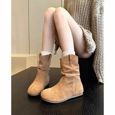 Western denim Martin boots for women in khaki color, featuring a low heel and flat sole, styled with a cozy knitted sweater.