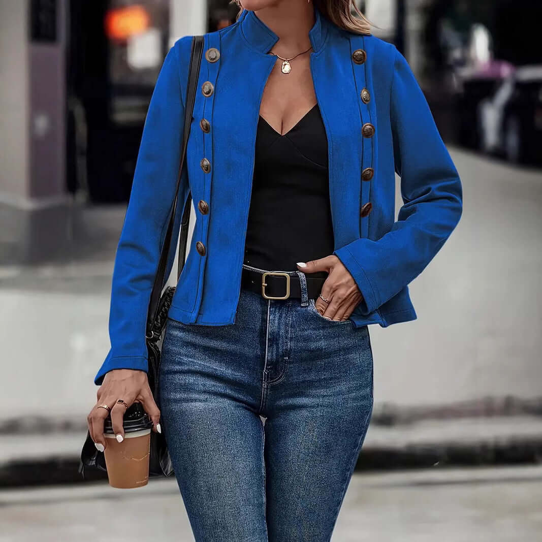 Long-sleeved retro blue coat with metal buttons, paired with a black top and blue jeans, perfect for stylish women.
