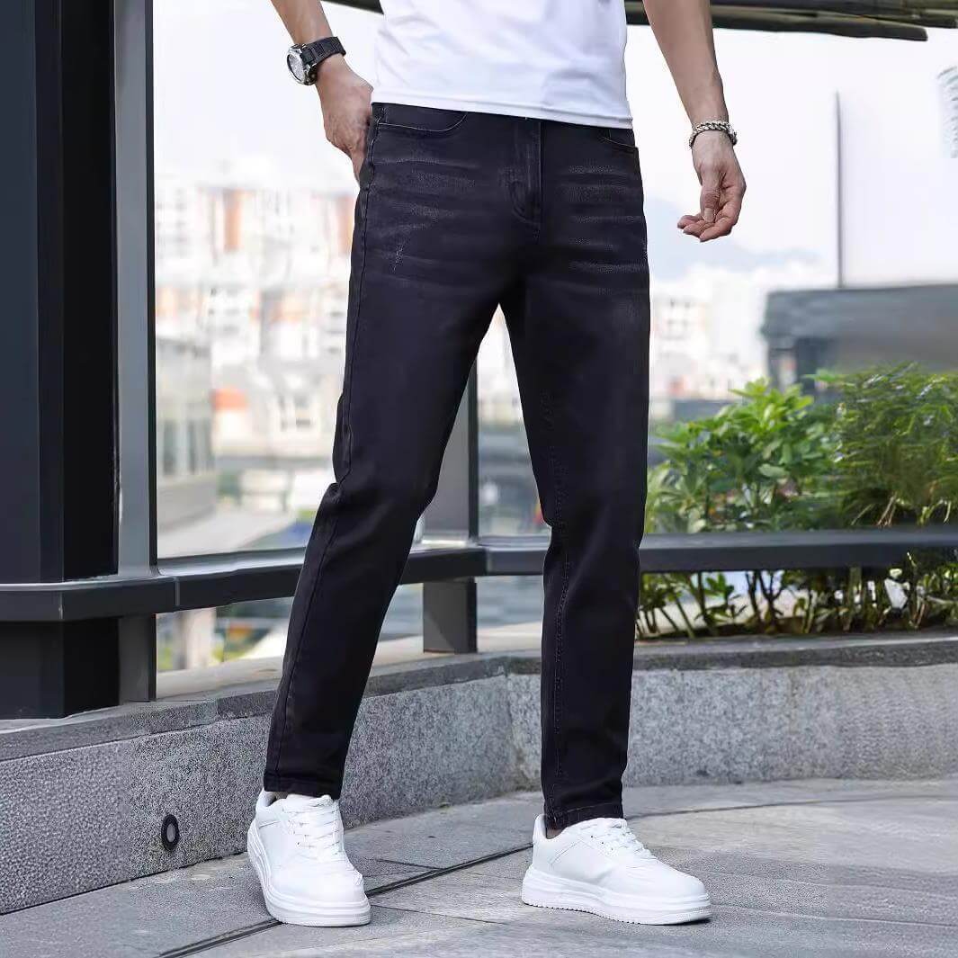 Men's stretch slim jeans in black, perfect for daily wear, featuring a mid waist and zip placket.