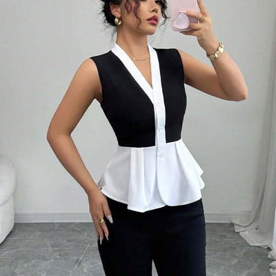 Women's sleeveless black and white false-two-piece shirt with slim fit style and elegant peplum design.