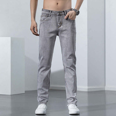 Men's versatile gray jeans with a mid waist design, perfect for casual leisure wear.