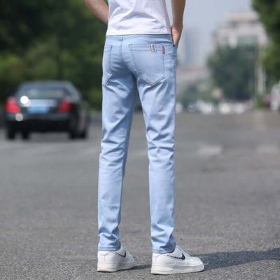 Men's light blue slim straight stretch denim trousers seen from the back, perfect for spring and summer.