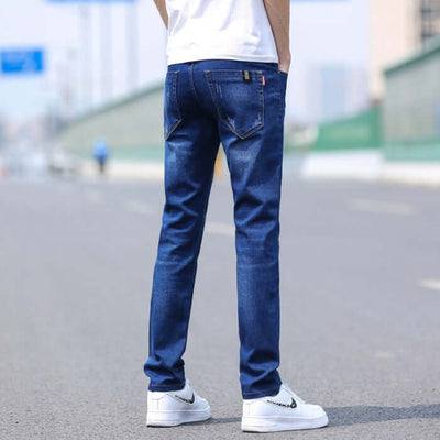 Men's slim straight stretch denim trousers in dark blue, featuring a mid-waist design and thin fabric for spring and summer fashion.