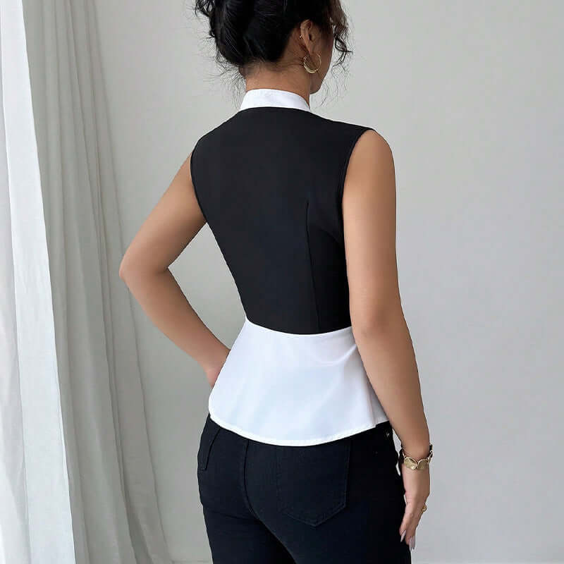 Women's sleeveless black and white false-two-piece shirt featuring a slim fit and stylish contrast colors.