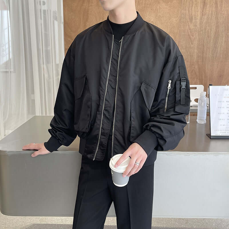 Men's light black bomber jacket with pockets, stylish autumn outfit for casual wear.