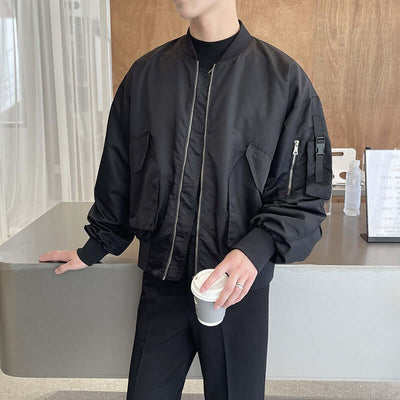Men's light black bomber jacket with pockets, stylish autumn outfit for casual wear.